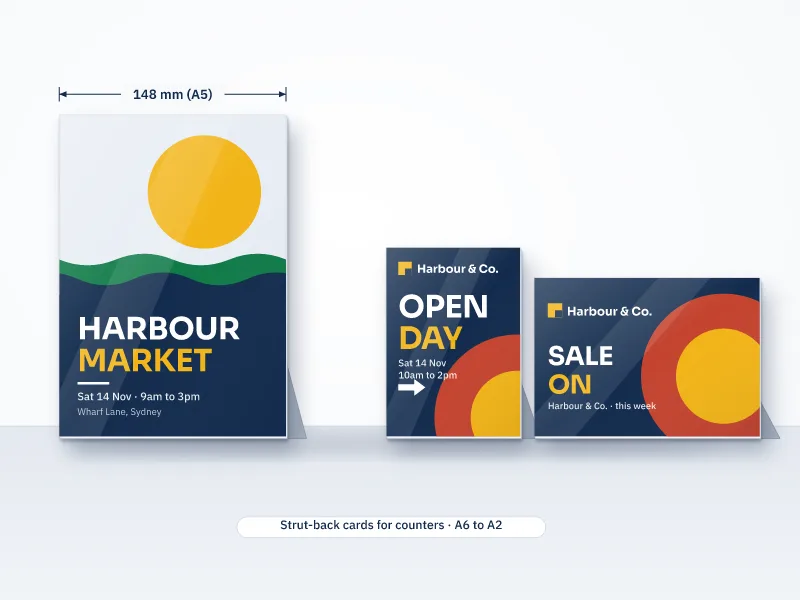 Illustration of A5 portrait, A6 portrait and A5 landscape counter cards standing on a counter with fold-out strut backs