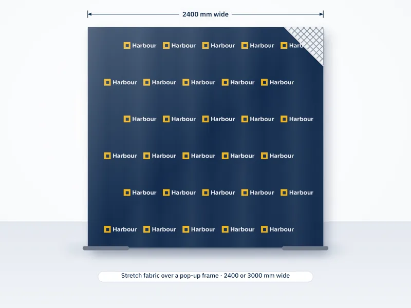 Illustration of a 2400 mm wide fabric media wall with a repeating logo pattern and a corner lifted to show the pop-up frame underneath