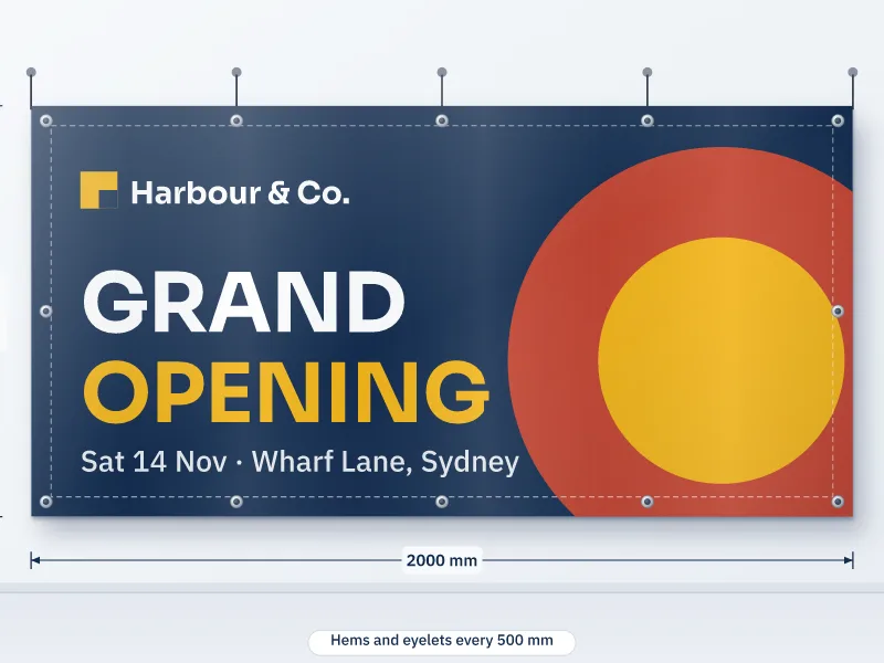 Illustration of a 2000 by 1000 mm PVC banner with hems and eyelets hung on a wall