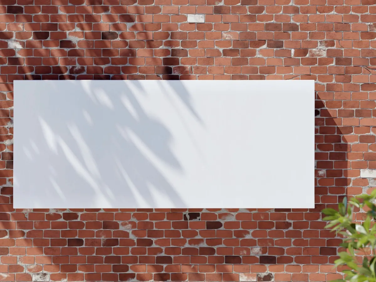 Large blank banner fixed to a red brick wall